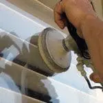 Commercial Property Management Company Cleaning Service - Pure Clean restoring a glass window